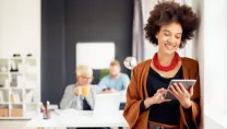 Woman looking at a tablet in office