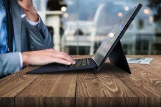 person typing on computer