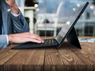 person typing at computer