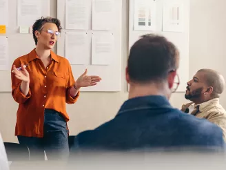 Woman presenting to an audience